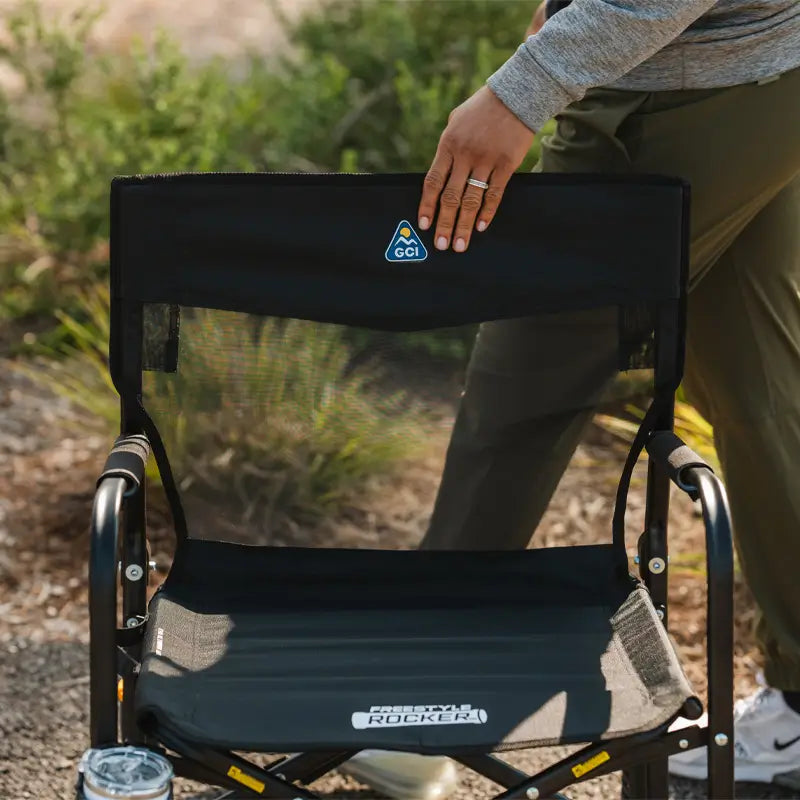 Close-up of the Black Freestyle Rocker Elite’s mesh back and seat branding.