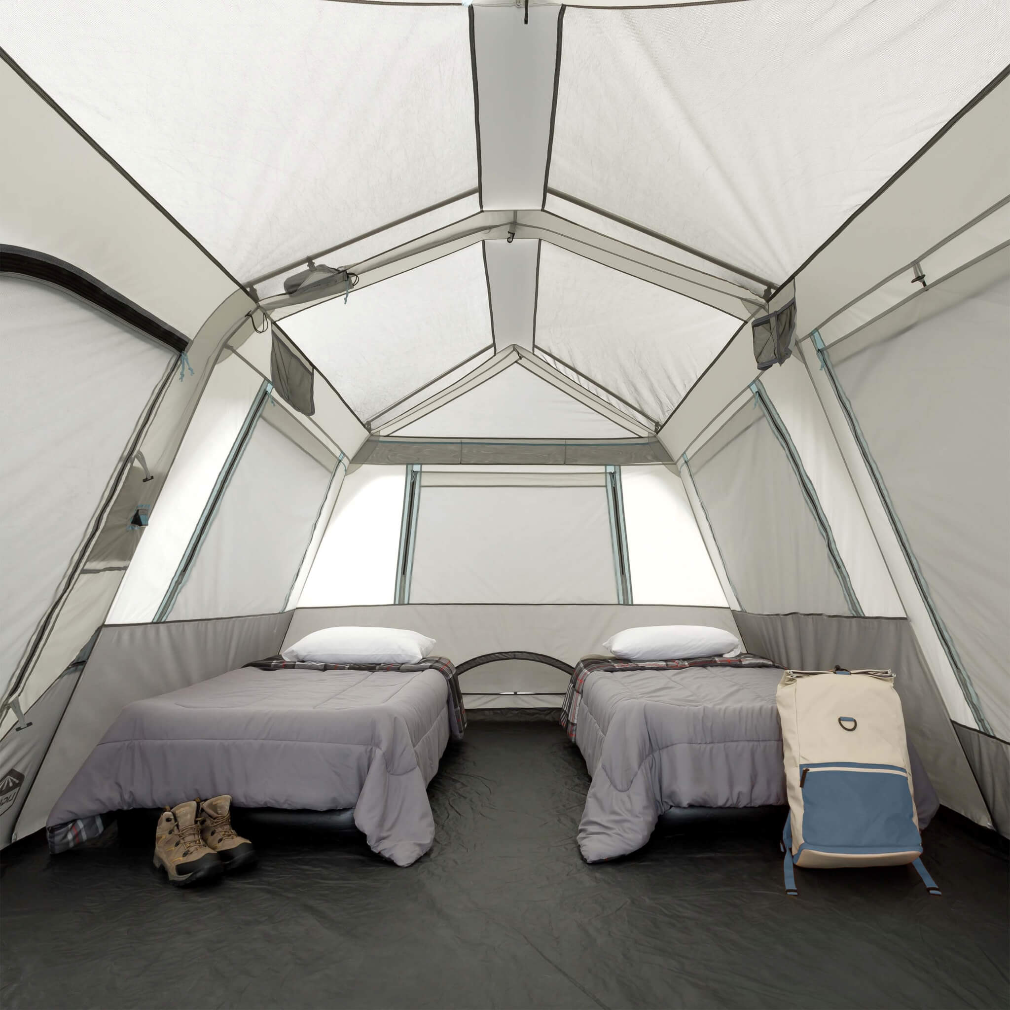 Inside CORE 10 person lighted instant cabin tent in gray and blue with large windows, high ceiling, and spacious sleeping area.