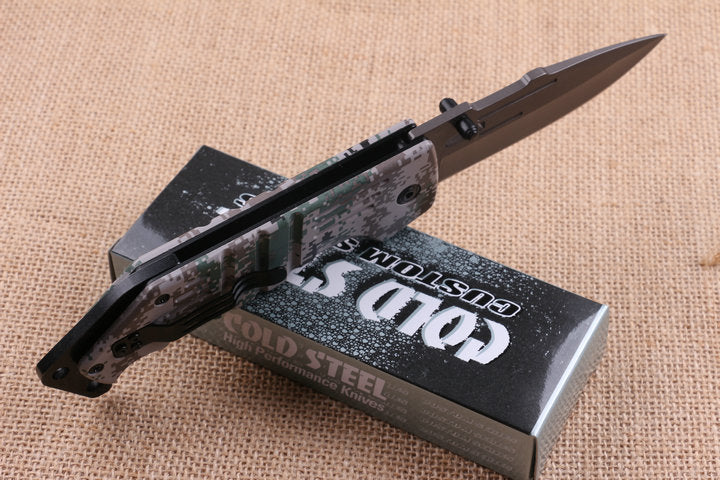 Quick-opening folding knife with camouflage handle