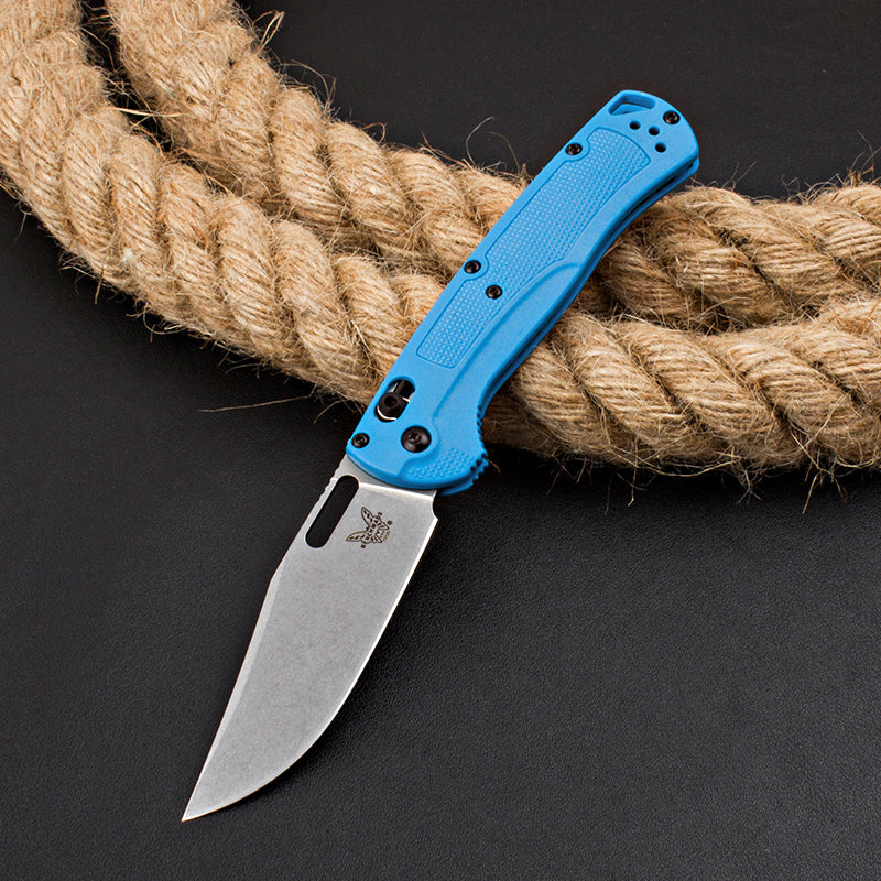 Axis-lock folding knife with fiberglass handle