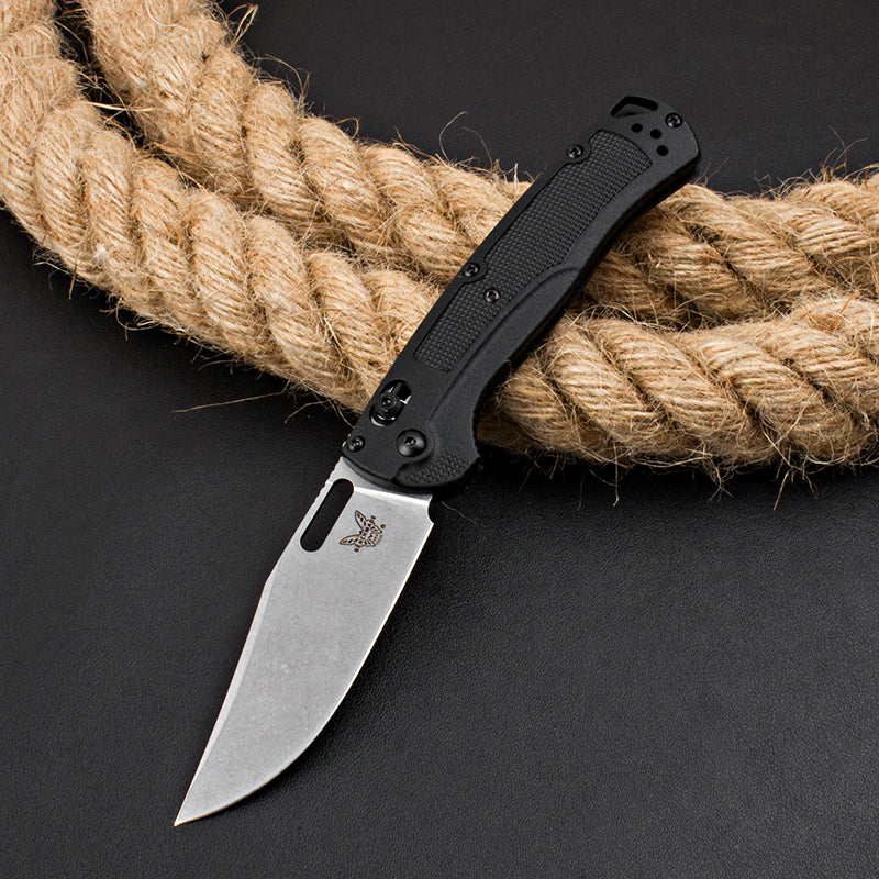 Axis-lock folding knife with fiberglass handle