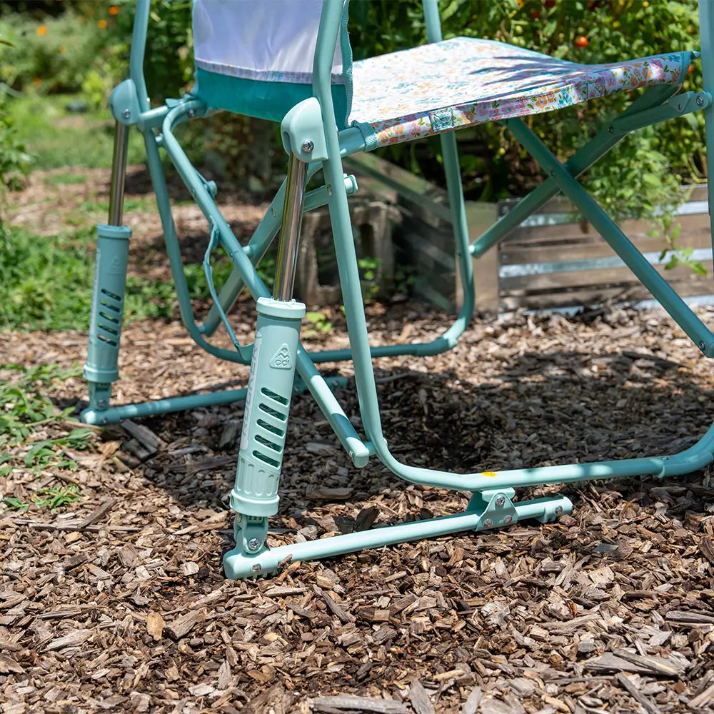 An up close angle of the spring action rocking technology on a teal freestyle rocker elite. 