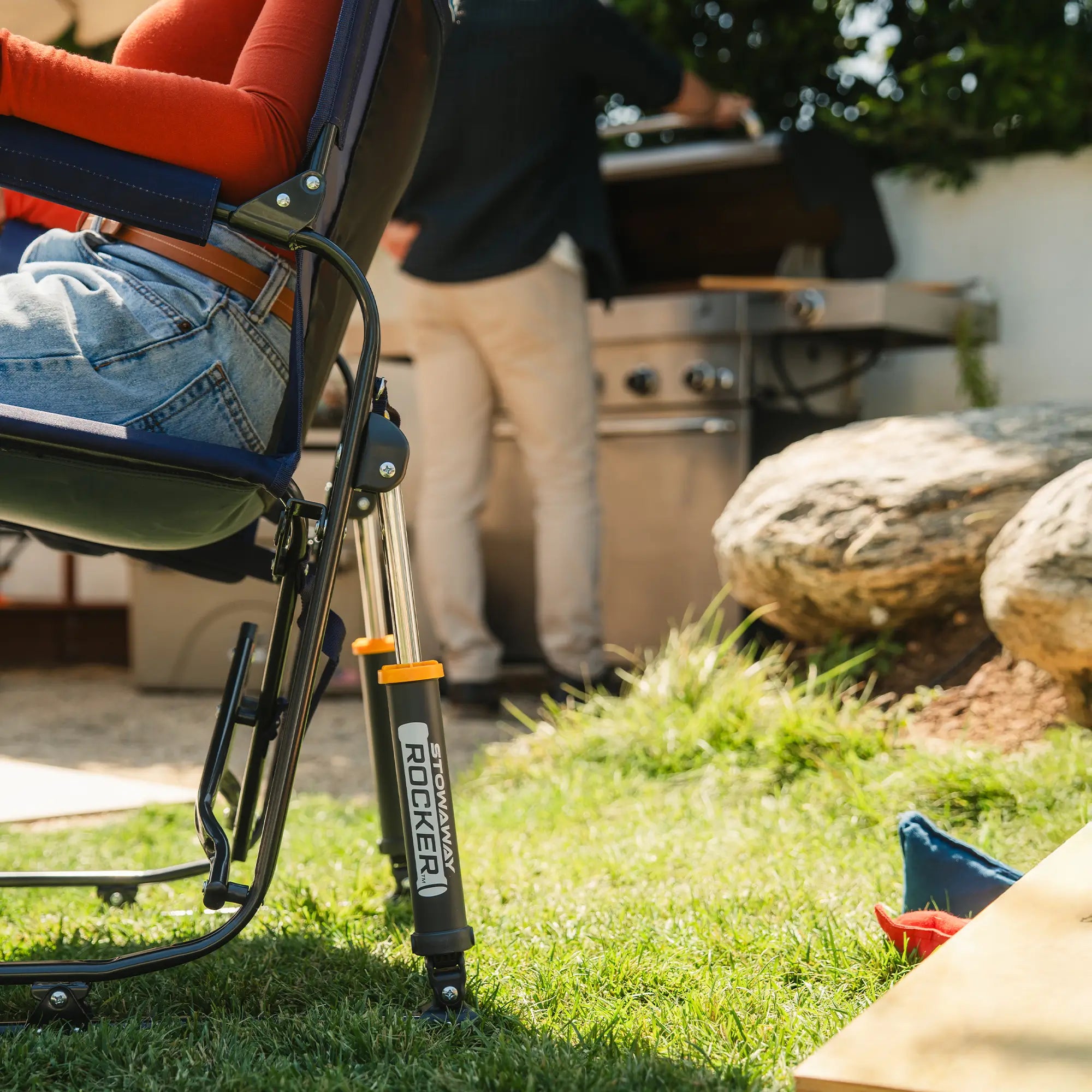 An up-close of the blue tailgater stowaway rocker spring action rocking technology. 