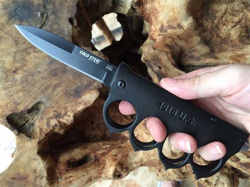 Knuckle guard defensive folding knife